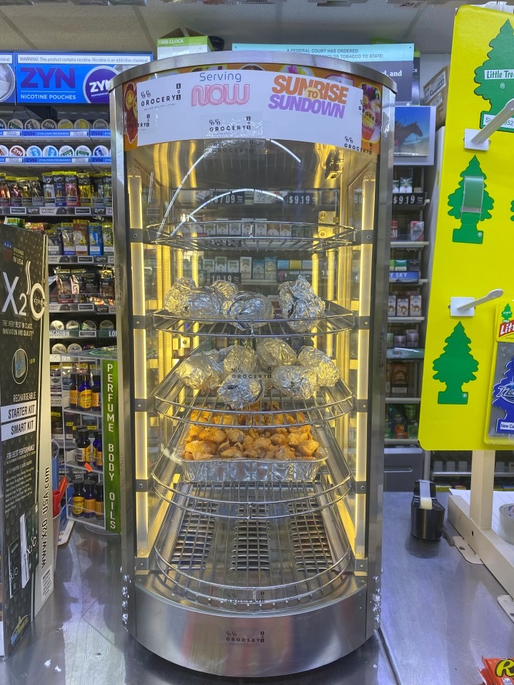 Prepared Grow UNTAMED food staged in a retail food warmer
